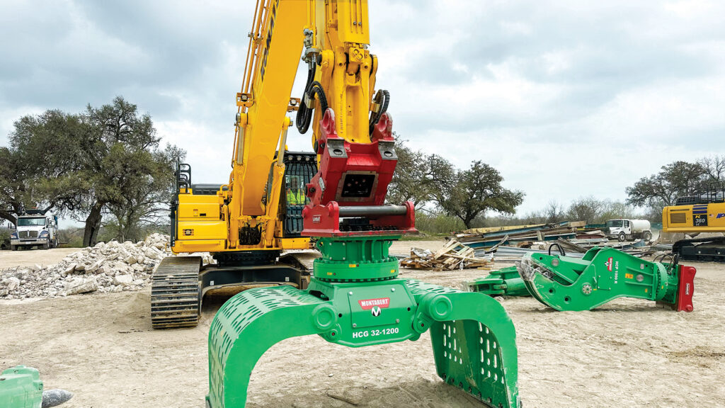 A Lehnhoff SQ80V fully automatic symmetric quick coupler shown connecting a Montabert attachment to a Komatsu excavator at the NDA Showcase.