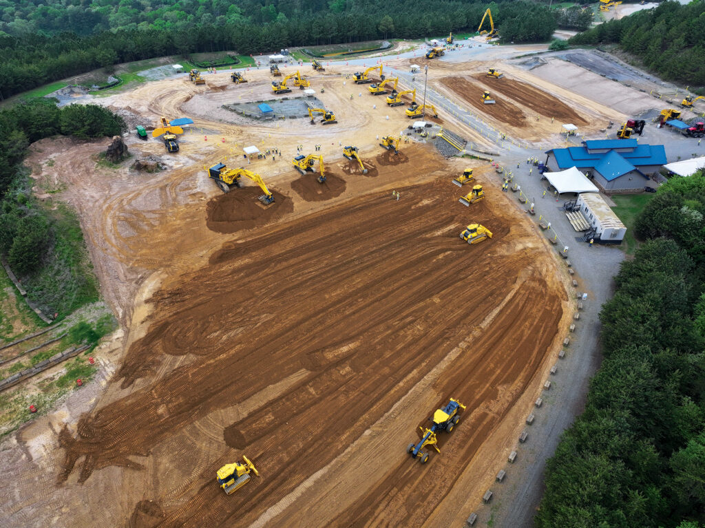 An overhead view of Komatsu machines and people at Demo Days.