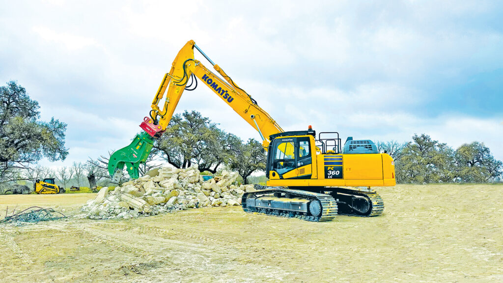 A Komatsu PC360LC-11 excavator equipped with a Montabert attachment displayed at the NDA Showcase.